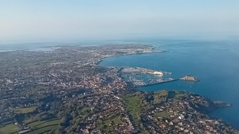 An view of Guernsey's St Peter Port and surrounding countryside taken from an air plane.  