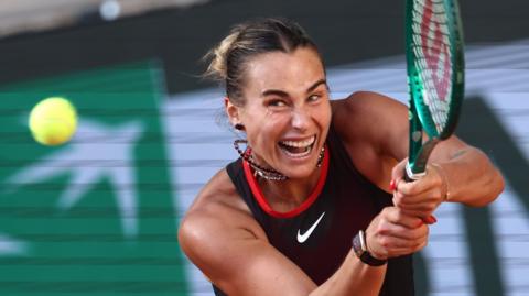 Aryna Sabalenka strikes the ball