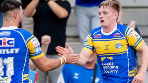 Alfie Edgell (right) celebrates scoring a try against Salford Red Devils in 2025