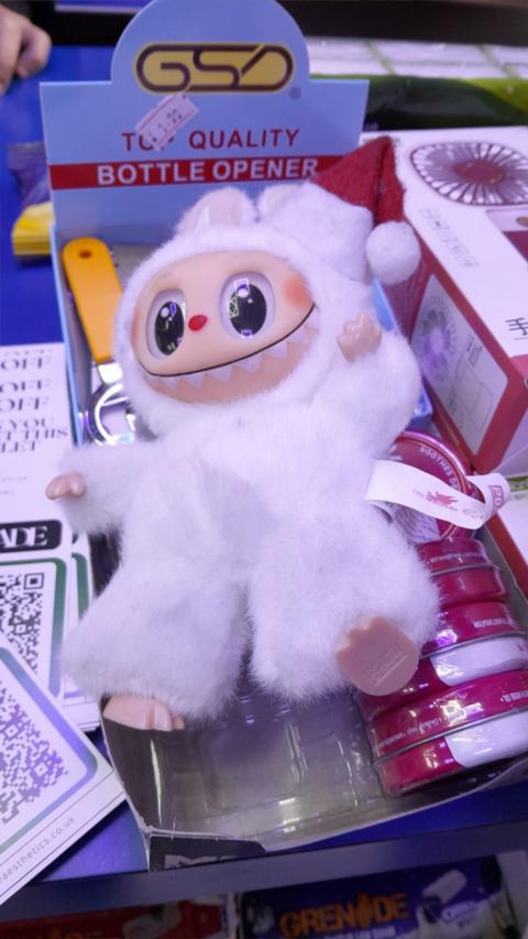 A fake Labubu doll in a box