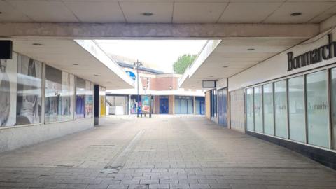 The walkway to Glover's Walk shopping centre