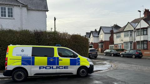 A police car pictured at the scene in Roundhill Road.