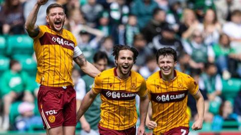 Motherwell's Lukas Fadinger (C) celebrates with Liam Gordon (L) and Tom Sparrow (R) after scoring to make it 1-0 during a William Hill Premiership match between Hibernian and Motherwell at Easter Road, on May 16, 2026, in Edinburgh, Scotland