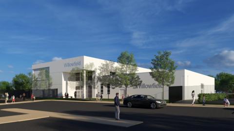 A CGI artists' impression of the new school, a large, white modern building surrounded by trees and shrubs. There is a car park to the front of the school.