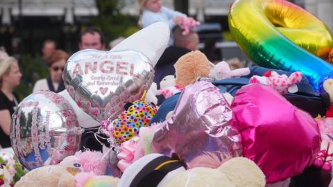 Balloons and teddy bears left in Southport for the victims of the knife attack which killed three young girls on 29 July.