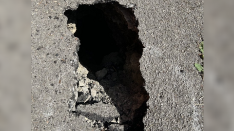 Birdseye shot of the sinkhole, it is one foot by two foot wide but is very deep