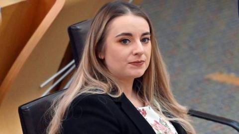 Megan Gallacher sitting in the Scottish parliament