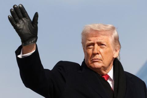 U.S. President Donald Trump gestures as he boards Air Force One to depart for Florida, at Joint Base Andrews, Maryland, U.S., January 16, 2026.