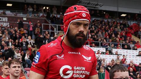 Josh Macleod leads Scarlets out of the tunnel