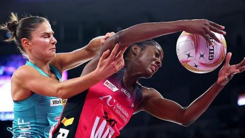 Netball players vie for the ball
