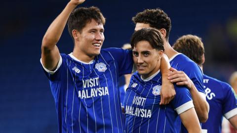 Rubin Colwill (left) and his brother Joel Colwill (right) celebrate