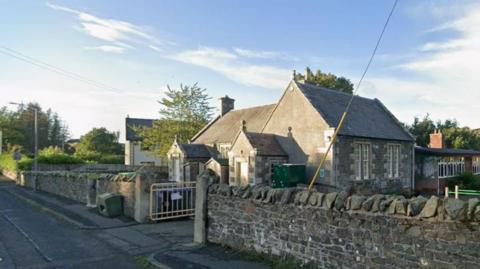 A small school building in the Borders, it is brick built but with a wooden windowed extension