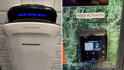 'Voice Activated' stickers on a hand dryer and a phone charging machine.