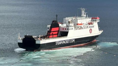The Ben-My-Chree in Douglas Bay. It is a large white, black and red vessel with STEAM-PACKET.COM written on the side.