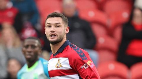 Luke Molyneux in action for Doncaster Rovers