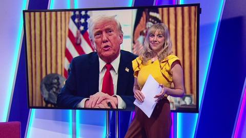 Jenny in the studio with Donald Trump in the screen