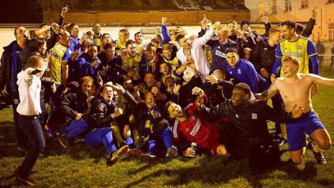 Hashtag United celebrate winning the Eastern Counties League Division One South title