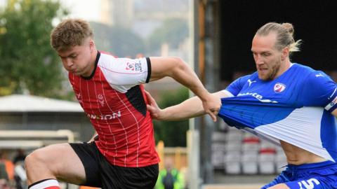 Freddie Draper of Lincoln City and Jamie Grimes of Chesterfield