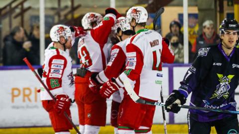 Cardiff Devils celebrate a goal against Manchester Storm