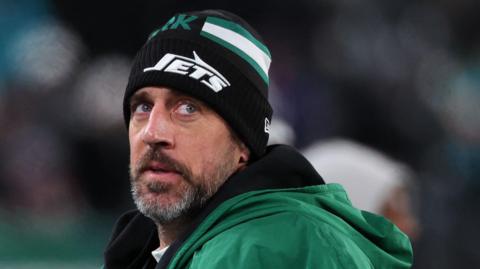 Aaron Rodgers stood on the New York Jets' sideline