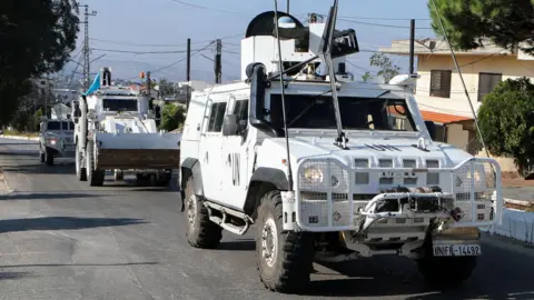 UN peacekeepers drive near the border with Israel