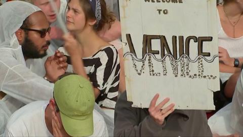 Protest placard at the Venice Film Festival