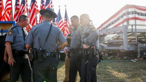 Law enforcement agents stand near the stage of a campaign rally for Republican presidential candidate former President Donald Trump on July 13, 2024 in Butler, Pennsylvania. 