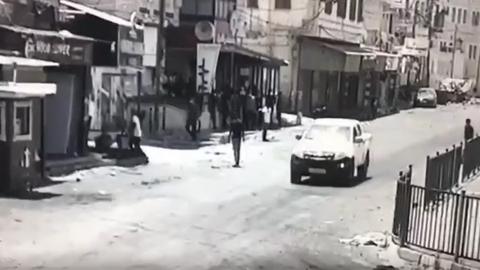 Screengrab of CCTV footage showing Abdul Rahman Hassan Ahmed Hardan standing in a street in Jenin moments before he was shot and killed by Israeli forces during a major military operation in the West Bank city (4 July)