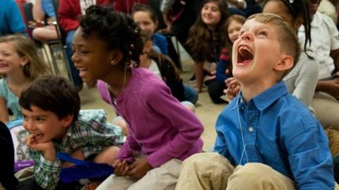 A group of children laughing