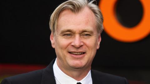 Christopher Nolan says the strike is about "jobbing actors, staff writers trying to raise a family, trying to keep food on the table"