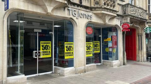 A general view of the outside of the TGJones store in Ipswich. Large yellow sale signs can be seen in the front windows.