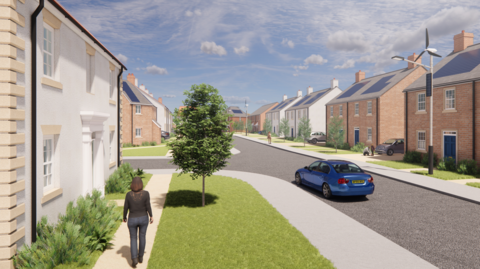 Architect's image of the new estate shows a street of housing with a road with a car in it and a one on the left walking down the street