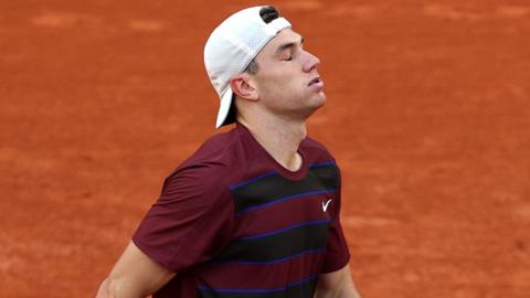 Jack Draper reacts to his loss to Alexander Bublik at the French Open