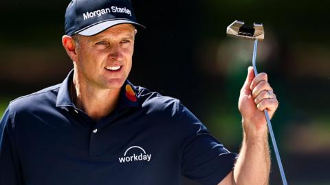 Justin Rose acknowledges the cheers after holing a birdie putt