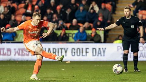 Shayne Lavery takes a penalty for Blackpool