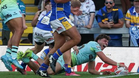 Owen Dagnall touching the ball on the try line
