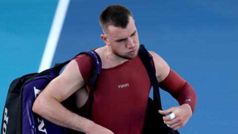 Jack Draper walks off court after his Miami Open defeat by Reilly Opelka