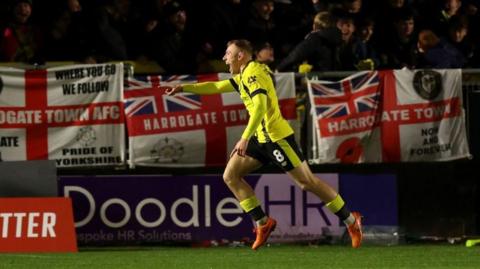 Dean Cornelius celebrates scoring Harrogate Town's goal