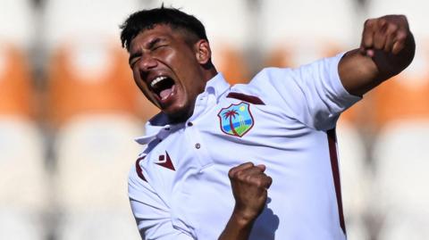 West Indies' Gudakesh Motie celebrates after taking the wicket of Pakistan's Kamran Ghulam 