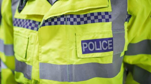 Close up of a police jacket.