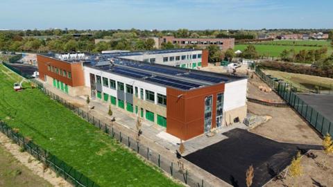 An aerial view of a two-storey school.