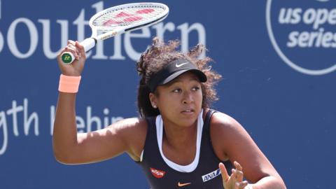 Naomi Osaka hitting a return at the Western and Southern Open