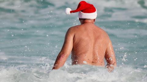 Swimmer in a santa hat