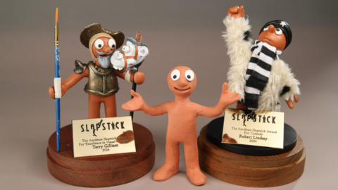 Two personalised Morph plasticine characters standing either side of the original Morph character