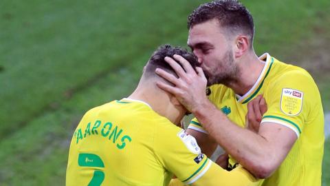 Max Aarons of Norwich City is congratulated after his late winner