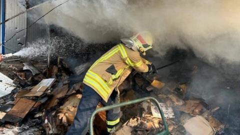 Firefighter at market in Bakhmut, Donetsk region, hit by Russian missile strike - 30 July