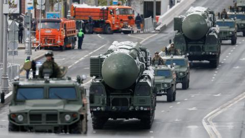 A file photo of Russian military vehicles, including Yars intercontinental ballistic missile system units, driving along a road before a military parade on Victory Day in Russia