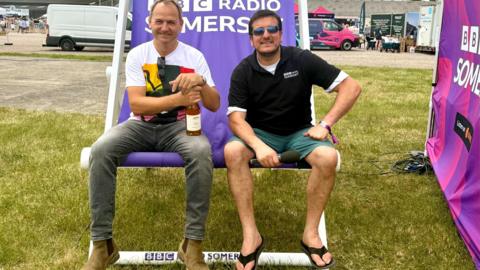 Ben Collins and presenter sitting on a deckchair