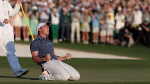 Rory McIlroy falls to his knees in triumph after winning the 2025 Masters