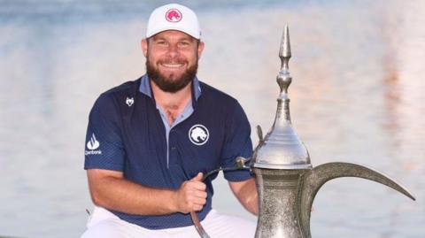 Tyrrell Hatton with the winners trophy